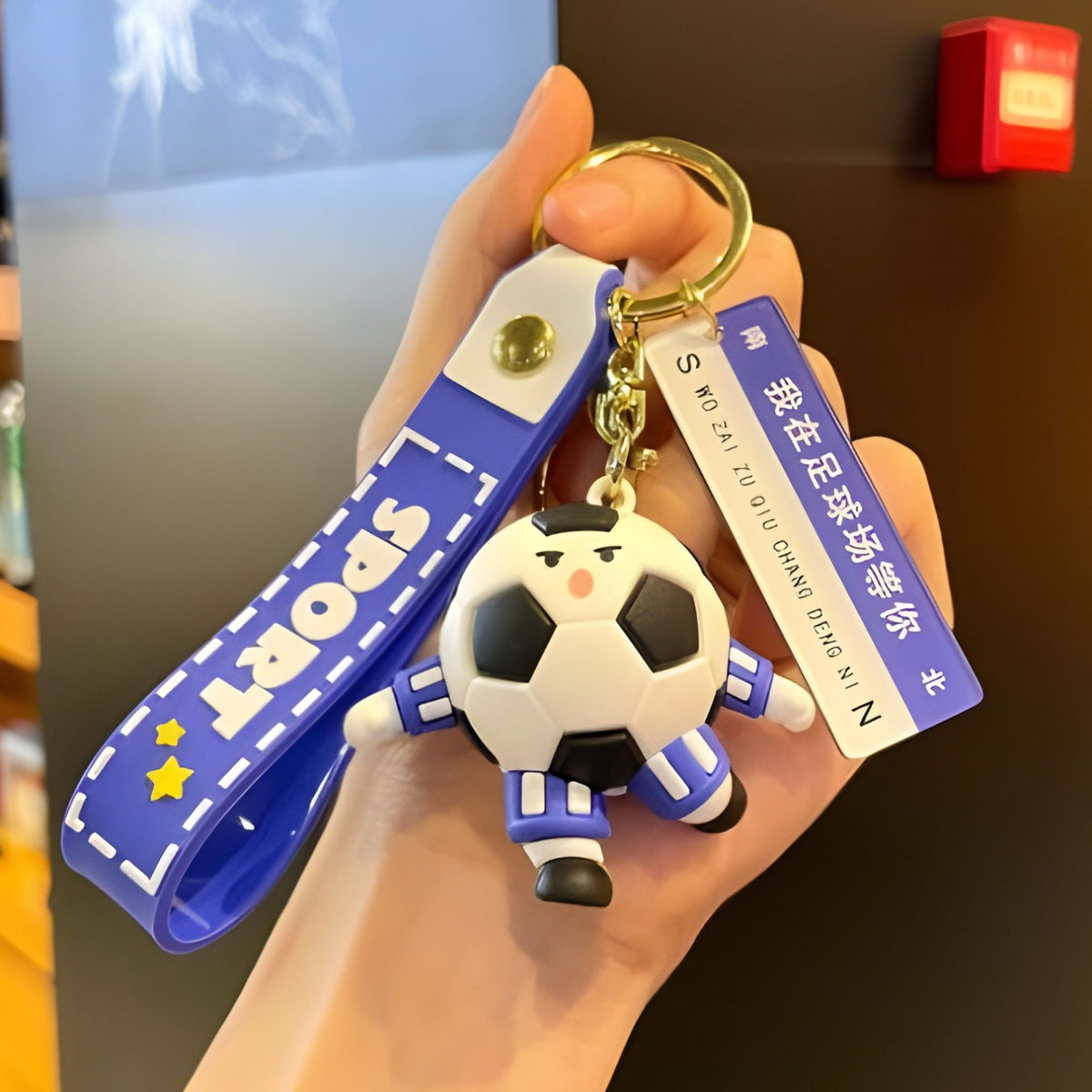 Breloc Chei Minge de Fotbal cu Casti, Accesoriu Ghiozdan si Rucsac cu Mesaj Te Astept pe Teren, Cupa Mondiala, Acril, 50 g, Albastru