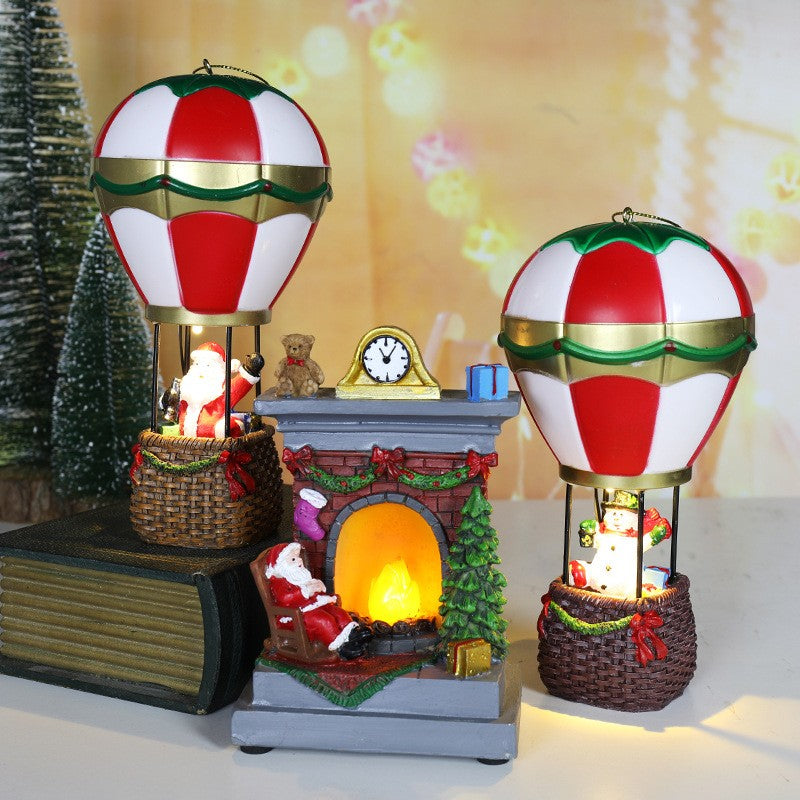 Decoratiune de Craciun Tip Semineu, Figurina Mos Craciun cu Flacara LED, Rasina, 13.5 x 9 x 6 cm, Gri/Rosu