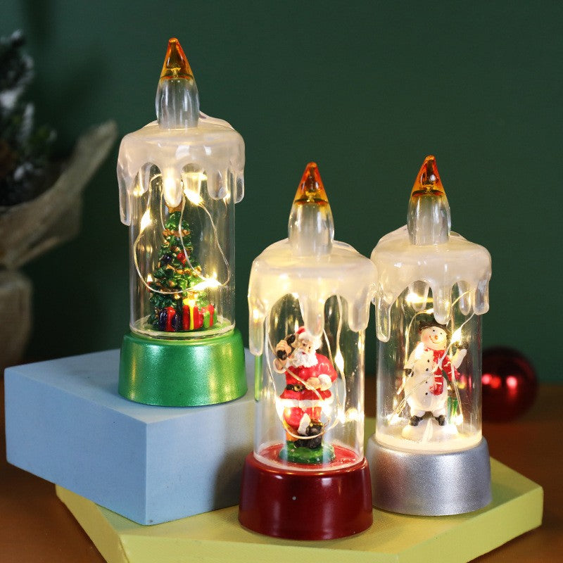 Decoratiune de Craciun Tip Lumanare cu LED, Glob de Zapada si Model Brad, Efect Ninsoare cu Sclipici, Plastic si Cristal, 13 x 5 x 5 cm, Baza Verde, Transparent