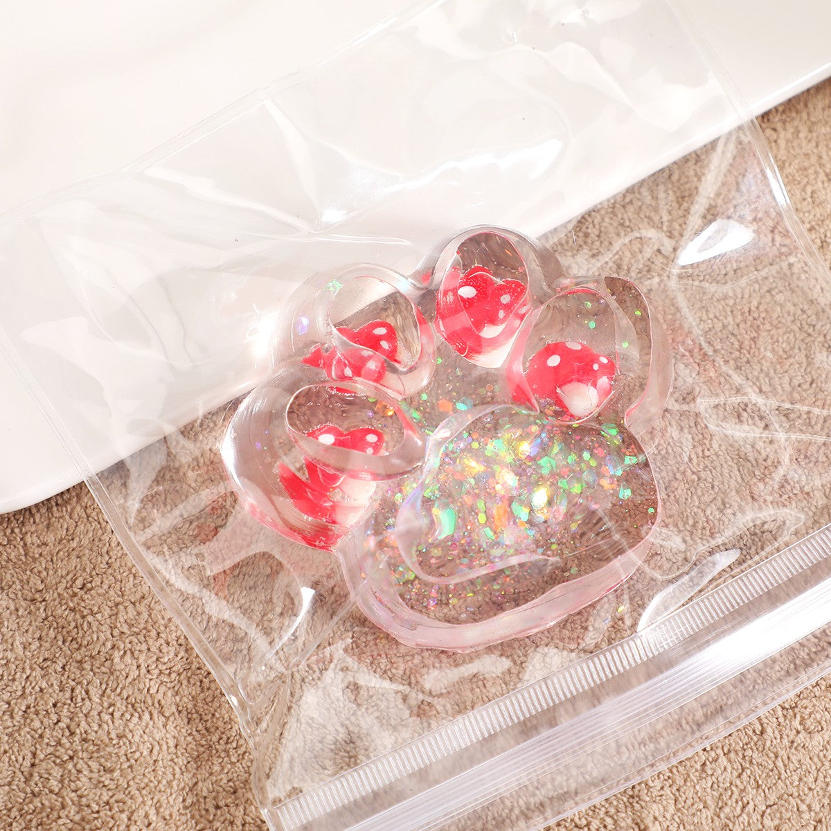 Jucarie Antistres Squishy, Model Labuta de Pisica Cat Paw, Revenire Lenta, Material TPR Moale, Transparent cu Insertii Animate, 6.5 x 7 cm, 62 g