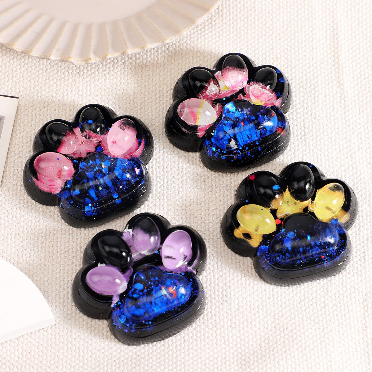 Jucarie Antistres Squishy, Model Labuta de Pisica Cat Paw, Revenire Lenta, Material TPR Moale, 6.5 x 6 cm, Negru cu Insertii Meduze