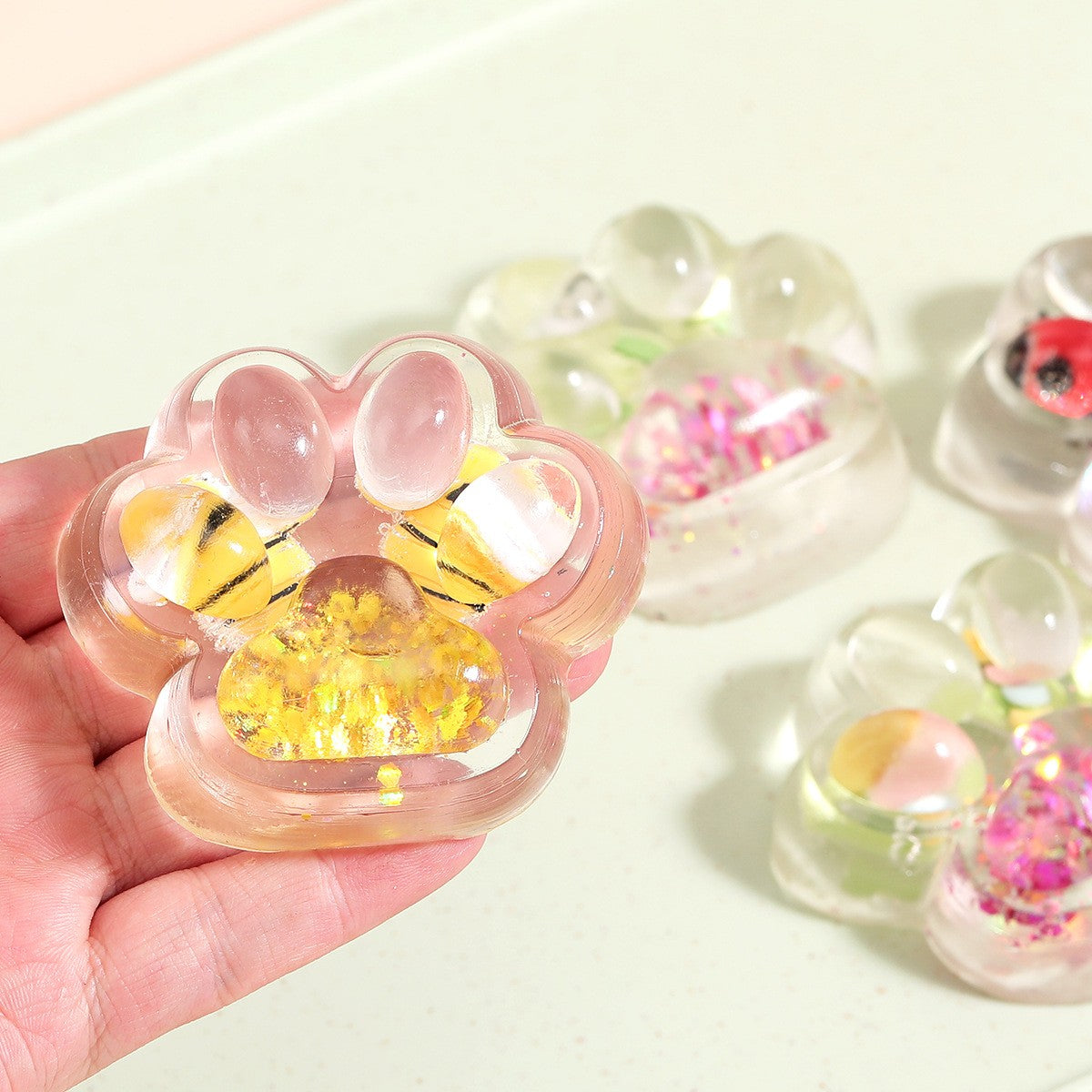 Jucarie Antistres Squishy, Labuta de Pisica cu Revenire Lenta, Model Transparent cu Inserții, Material TPR Moale, 6.5 x 7 cm, 62 g
