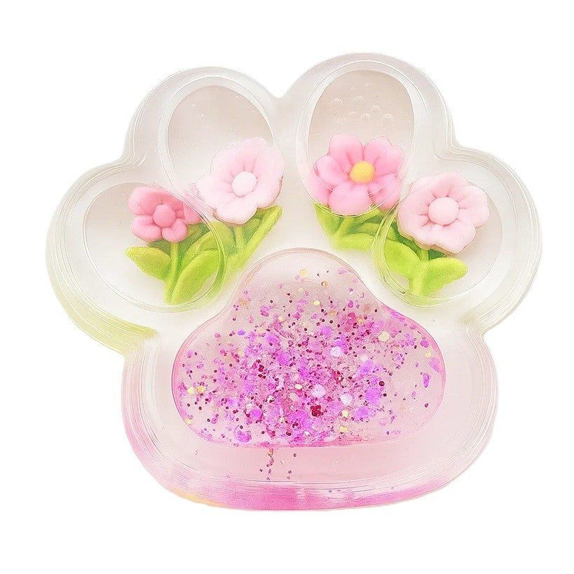 Jucarie Antistres Squishy, Labuta de Pisica Pufoasa cu Revenire Lenta si Insertii Flori, Material TPR Moale, 7 x 6.5 cm, Transparent Multicolor