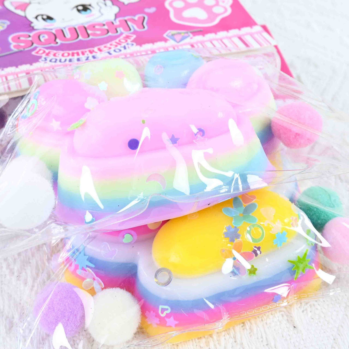 Jucarie Antistres Squishy, Labuta de Pisica Pufoasa cu Revenire Lenta, Material TPR Moale, 7.5 x 8.5 cm, Ambalaj Transparent, Multicolor, Model 27053