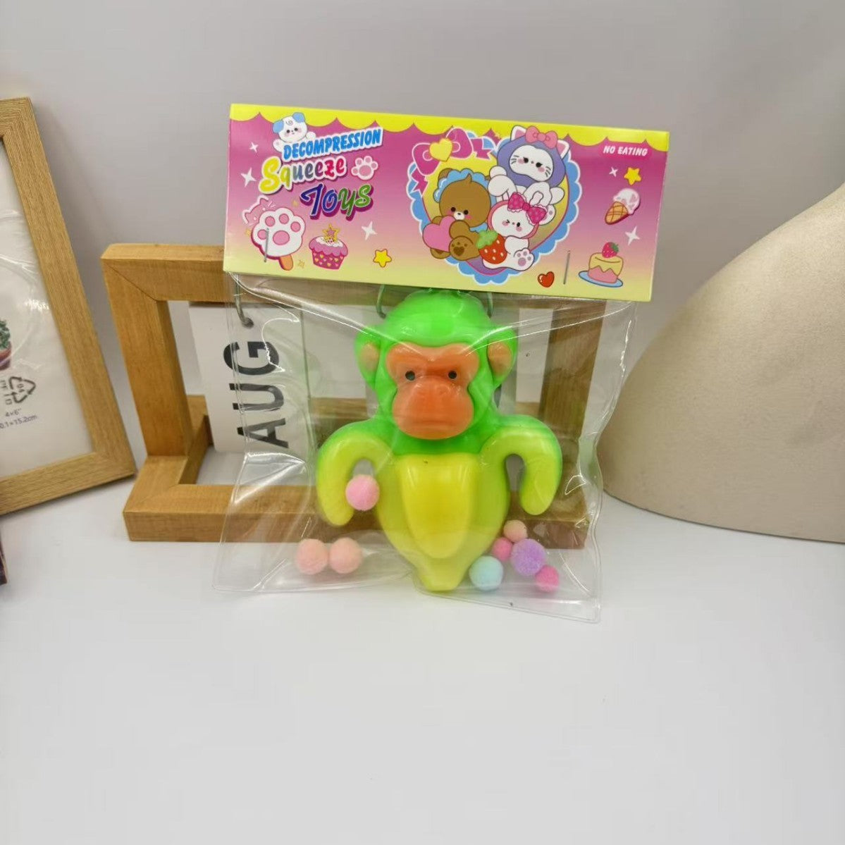 Jucarie Antistres Squishy Squeeze Toys, Model Banana Monkey cu Revenire Lenta, Material TPR Flexibil, 12 x 11 cm, 140 g, Galben/Verde