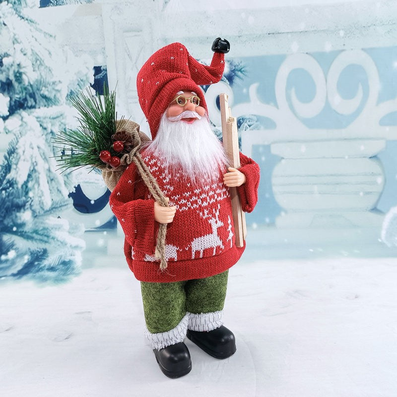 Figurina Decorativa Mos Craciun cu Lemne si Flori, Ornament Festiv pentru Interior si Exterior, Plastic si Textil Catifelat, 30 x 17 x 10 cm, Rosu/Verde
