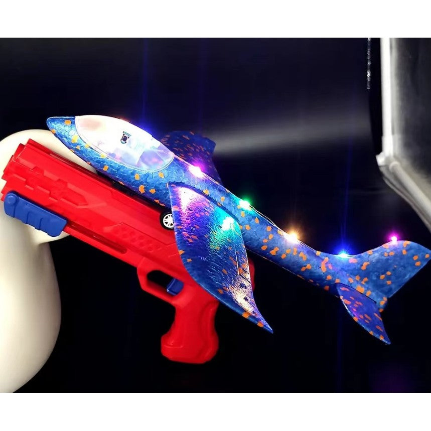 Pistol cu Lansator de Avion, Jucarie Interactiva cu Lumini si Roti, Distanta Lansare 10 m, Plastic si Polistiren, Avion 38 cm, Rosu/Albastru, +3 Ani