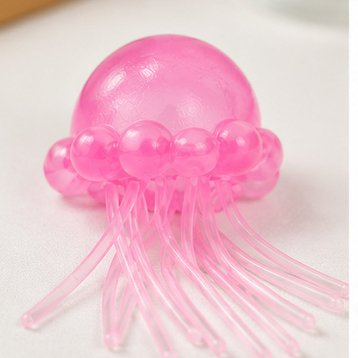 Jucarie Squishy Meduza, Antistres Senzorial Slow Rising cu Tentacule Flexibile, Silicon și Plastic Translucid, 100 g, Roz