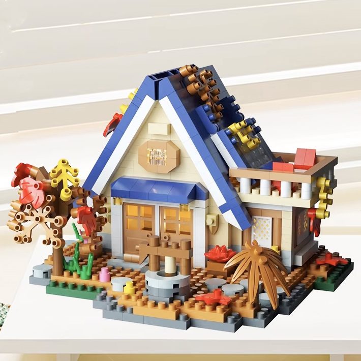 Set Constructie Forest Log Cabin, Model Casuta De Vis, Arhitectura Educativa, Material ABS, 715 Piese, 11.8x10.2x8.5 cm, Multicolor