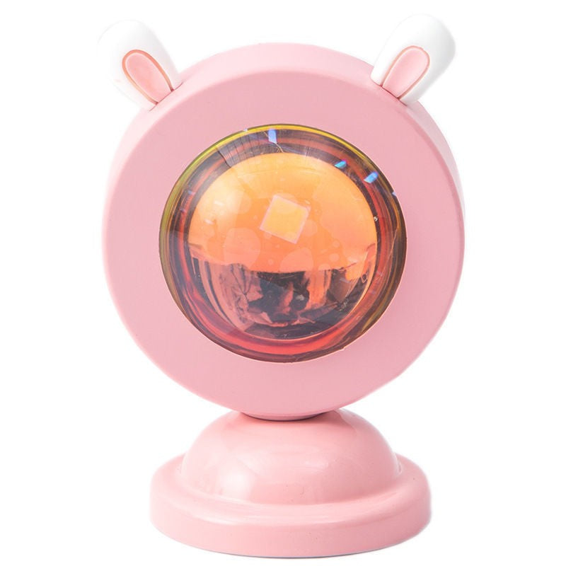 Lampa de Veghe Proiector Apus de Soare Sunset, RGB Multicolor cu Telecomanda, Lumina Ambientala pentru Foto si Vlog, Carcasa Aluminiu, Model Iepuras, Alimentare USB, Roz