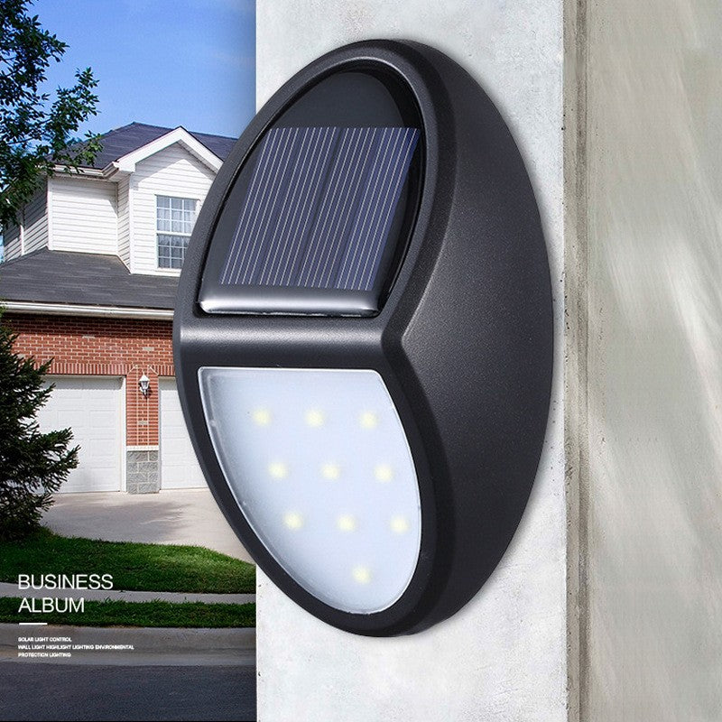 Aplica Solara LED de Perete, Lampa Exterior Ovala cu Senzor de Lumina, Protectie IP65, 10 LED-uri, Autonomie 8-10 Ore, Plastic, 12 x 7.5 cm, Alb Rece