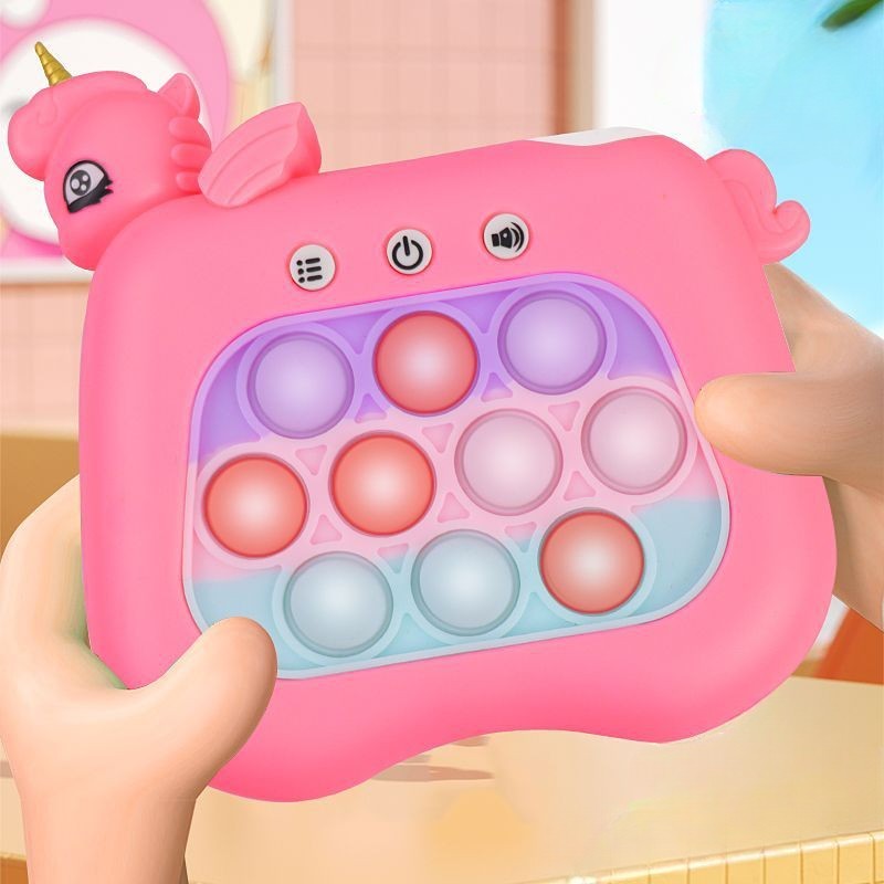 Jucarie Interactiva Tip Consola Pop-It pentru Copii, Joc de Memorie si Coordonare cu 120 Nivele, Efecte Sonore si Luminoase, Material ABS si Silicon, 13.5 x 12.5 cm, Model Unicorn, Fucsia