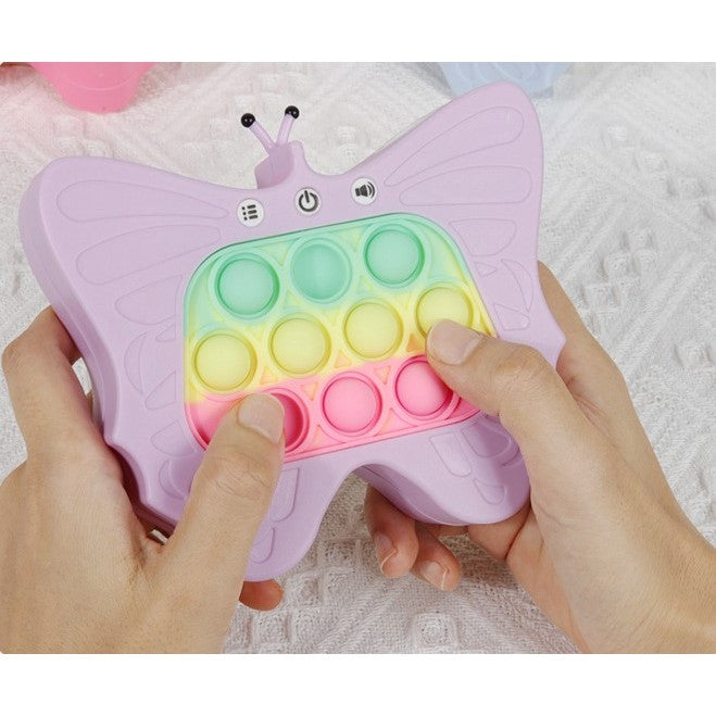 Jucarie Interactiva Tip Consola Pop-It pentru Copii, 120 Nivele de Joc, Functie Antistres cu Sunete si Lumini, Material ABS si Silicon, Model Fluture, 12 x 5.5 x 13.5 cm, Mov