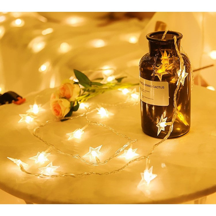 Instalatie Craciun cu 20 LED-uri tip Stea, Iluminare Ornamentala pentru Interior si Exterior, Alimentare cu Baterii, Fir Transparent din Cupru, 3 Metri, Alb Cald
