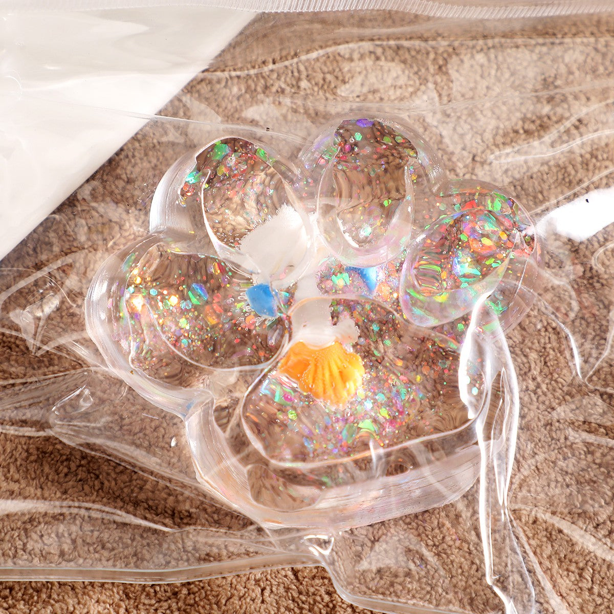 Jucarie Antistres Squishy cu Revenire Lenta, Model Labuta de Pisica Cat Paw, Silicon TPR Moale, Transparent cu Inseritii Ocean, 6.5 x 7 cm, 62 g