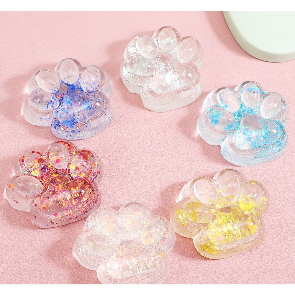 Jucarie Antistres Squishy Laba de Pisica, Revenire Lenta, Model Cat Paw cu Sclipici, Material TPR Moale, 6.5 x 7 cm, Transparent cu Inseritii, 62 g