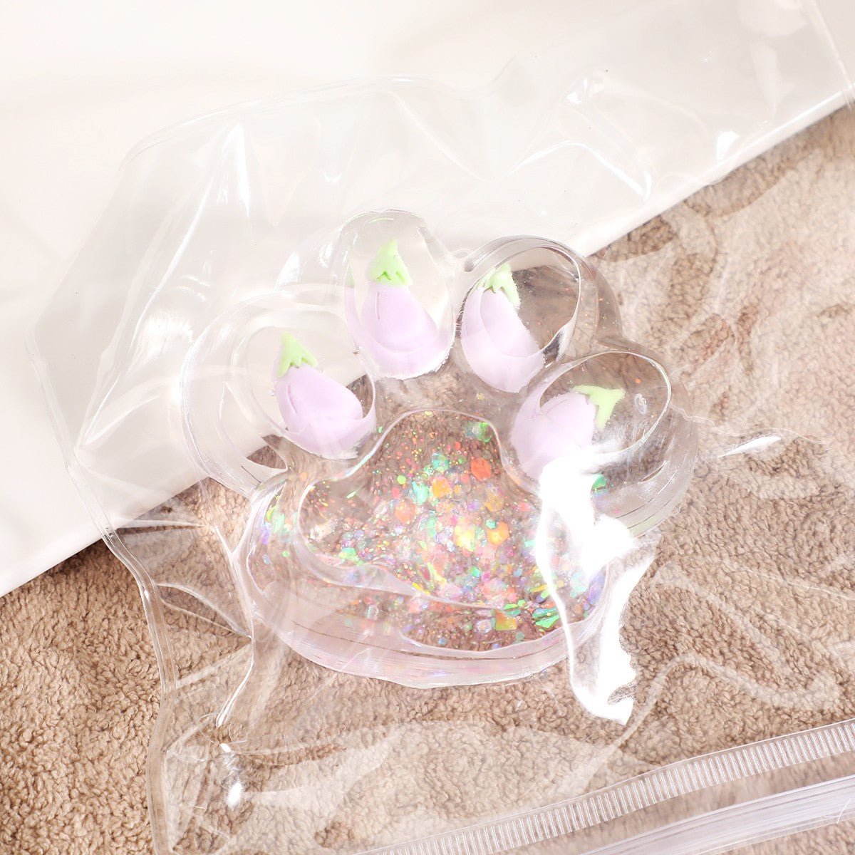 Jucarie Antistres Squishy, Model Labuta de Pisica Cat Paw, Revenire Lenta, Material TPR Moale, Transparent cu Insertii Animate, 6.5 x 7 cm, 62 g