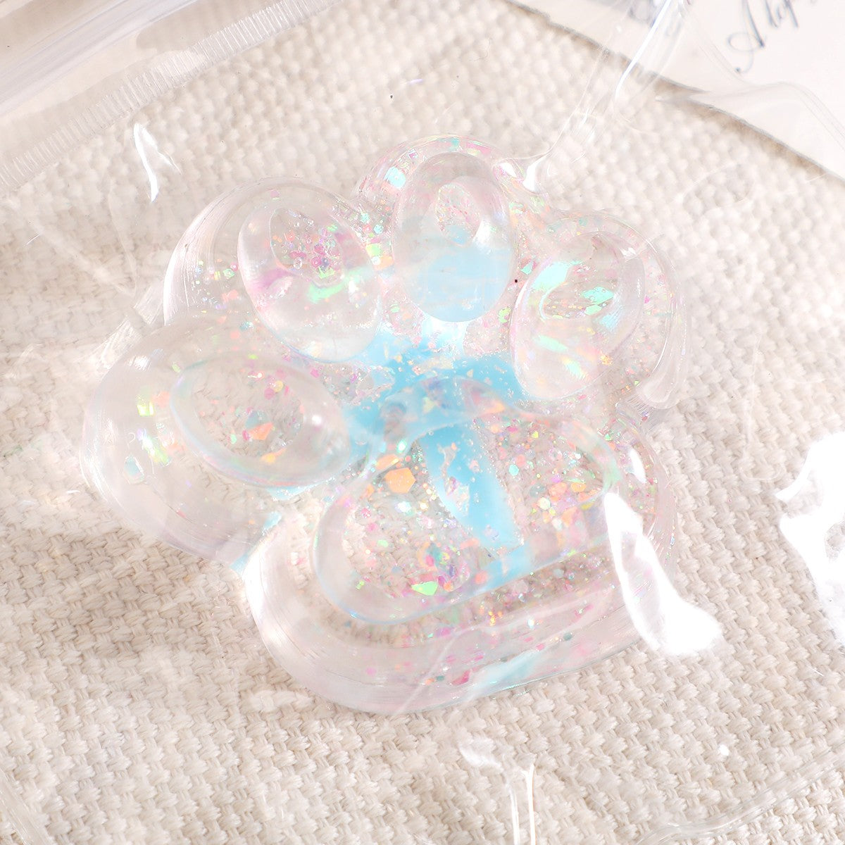 Jucarie Antistres Squishy, Labuta de Pisica cu Revenire Lenta, Squeeze Pinch Family, Material TPR Moale, 6.5 x 7 cm, Model 2 Flori, Transparent
