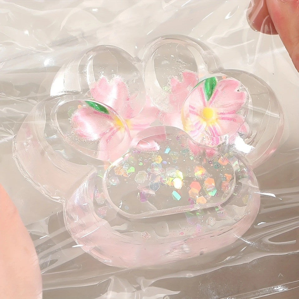 Jucarie Antistres Squishy Labuta de Pisica, Revenire Lenta pentru Relaxare si Senzorial, Material TPR Moale, Model Flori, 7 x 6.5 cm, Transparent Multicolor
