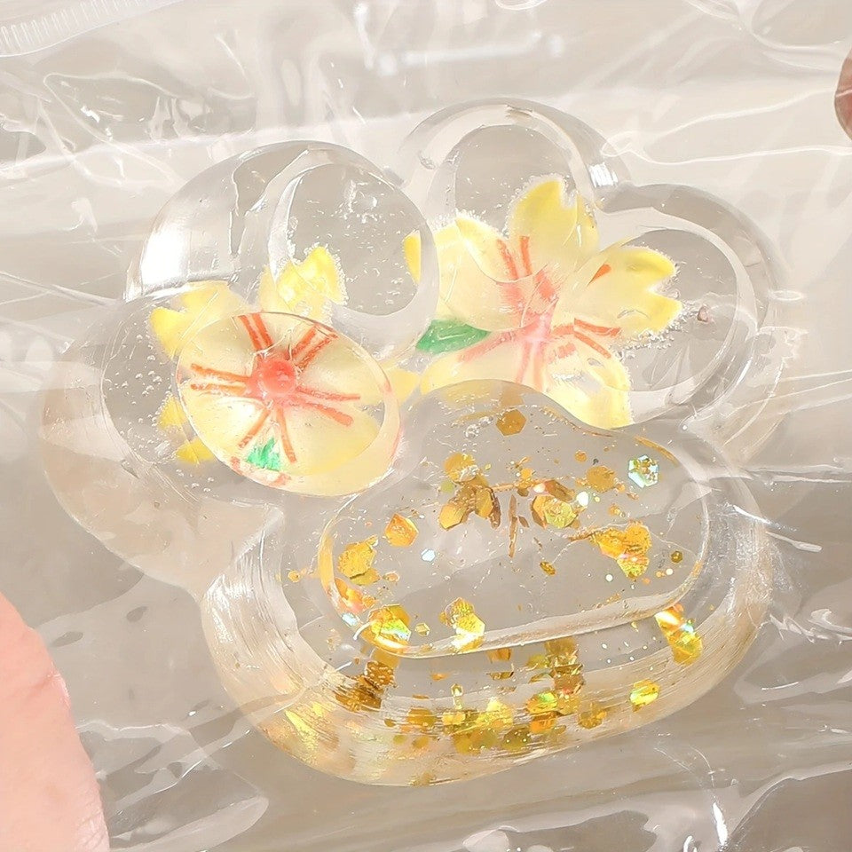 Jucarie Antistres Squishy Labuta de Pisica, Revenire Lenta pentru Relaxare si Senzorial, Material TPR Moale, Model Flori, 7 x 6.5 cm, Transparent Multicolor