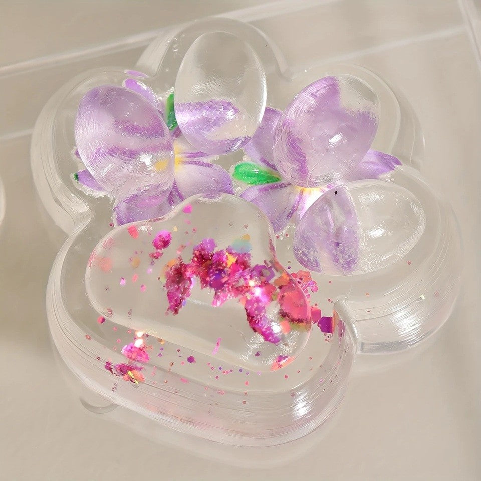 Jucarie Antistres Squishy Labuta de Pisica, Revenire Lenta pentru Relaxare si Senzorial, Material TPR Moale, Model Flori, 7 x 6.5 cm, Transparent Multicolor