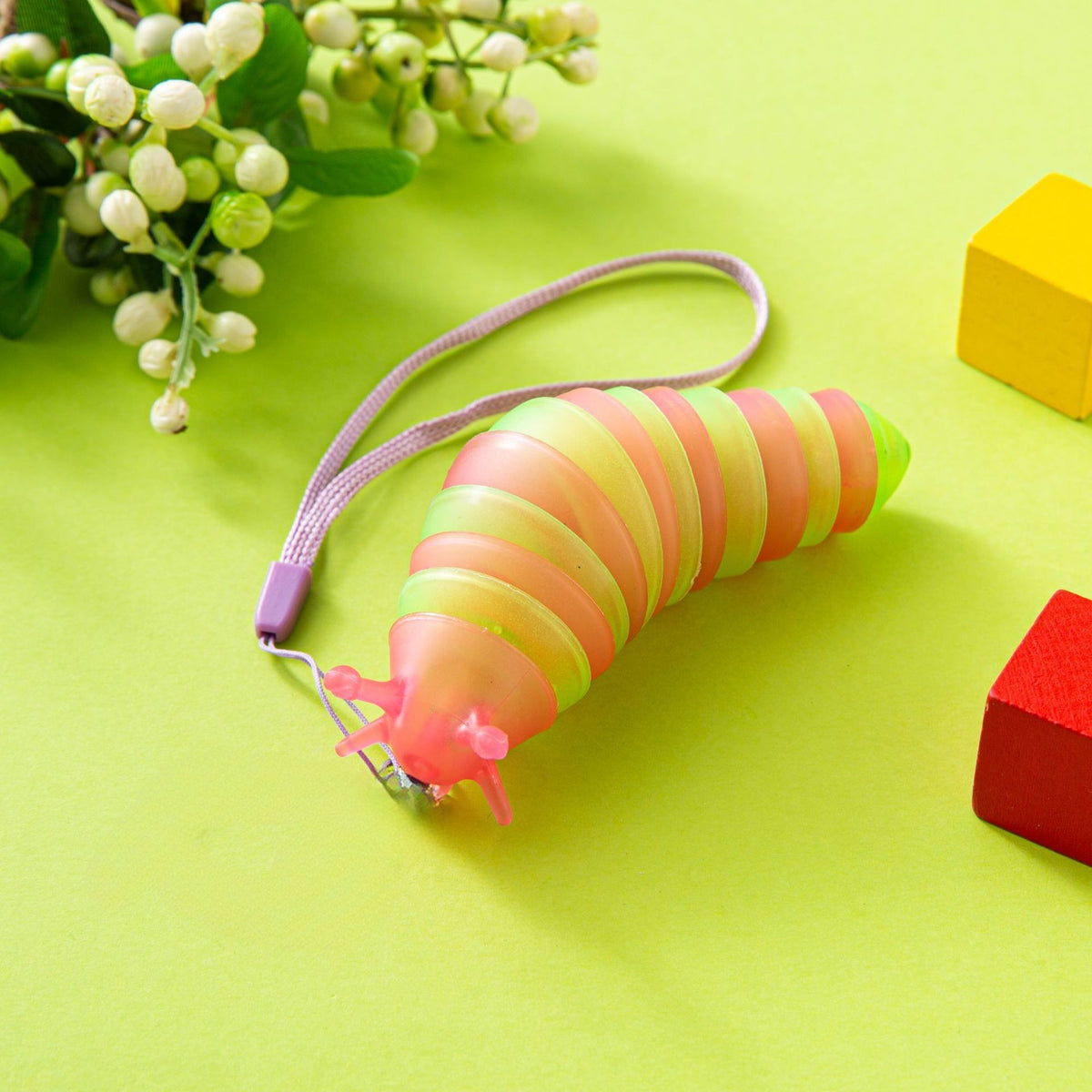 Jucarie Senzoriala Antistres, Omida Fidget Toy cu 14 Articulatii, Plastic, 11 cm, Roz/Verde