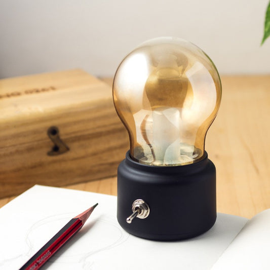 Lampa LED Decorativa Retro sub Forma de Bulb, Lumina Calda, Incarcare USB, Autonomie 12 Ore, Comutator Metalic, ABS si Sticla, Negru Transparent, 11x7x6 cm