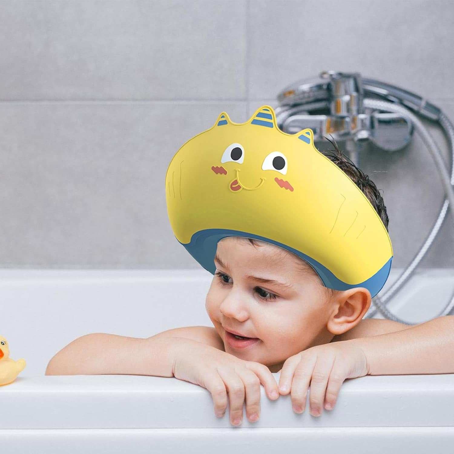 Fippy Casca de Dus pentru Copii, Protectie impotriva Samponului si Apei cu Protectii Urechi, Ajustabila 0-12 Ani, TPE si PP, Model Unicorn, Galben/Albastru