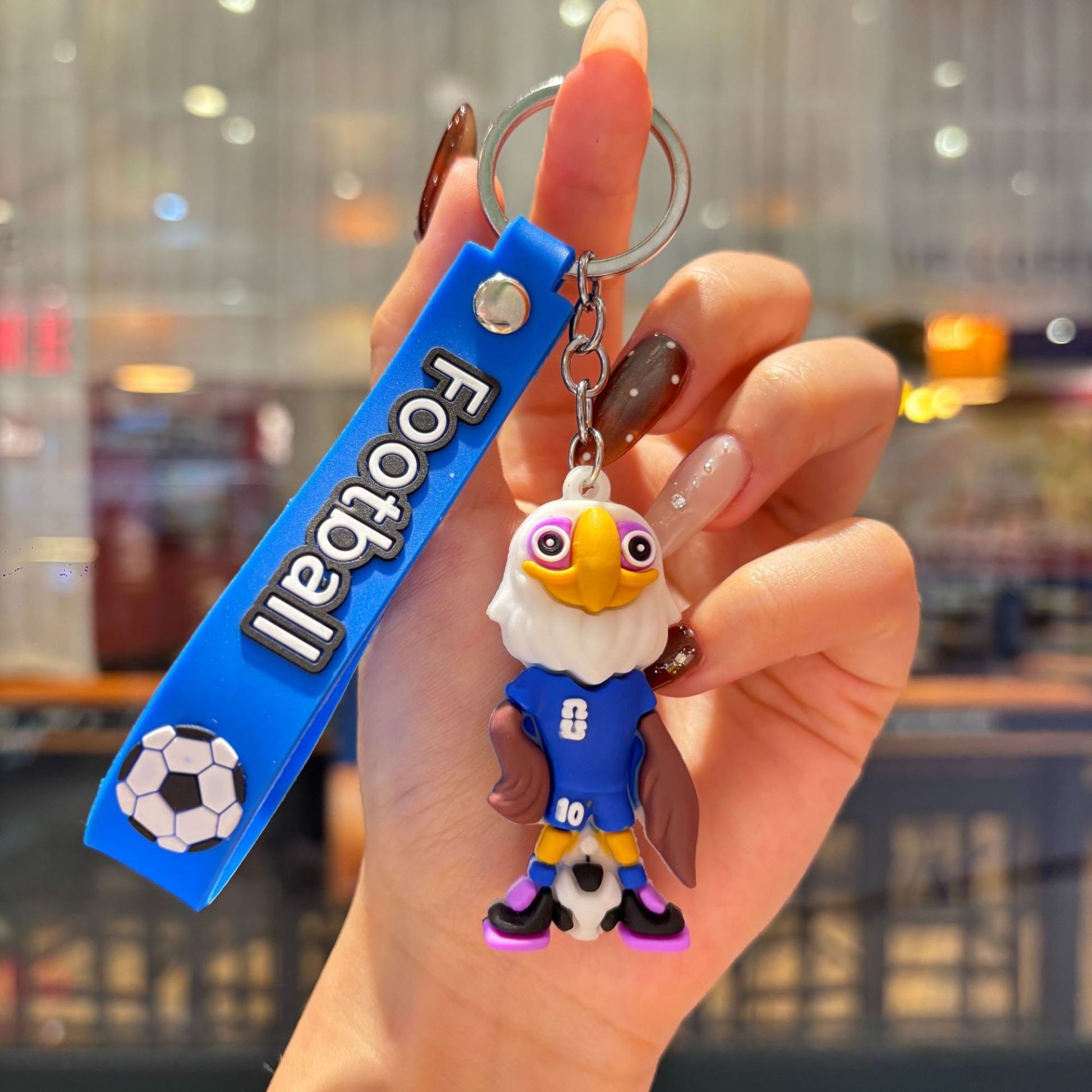 Breloc Chei Fotbal, Mascota Vultur Cupa Mondiala, Accesoriu Ghiozdan si Rucsac, Cauciuc Moale, 6.2 x 3.4 cm, Albastru