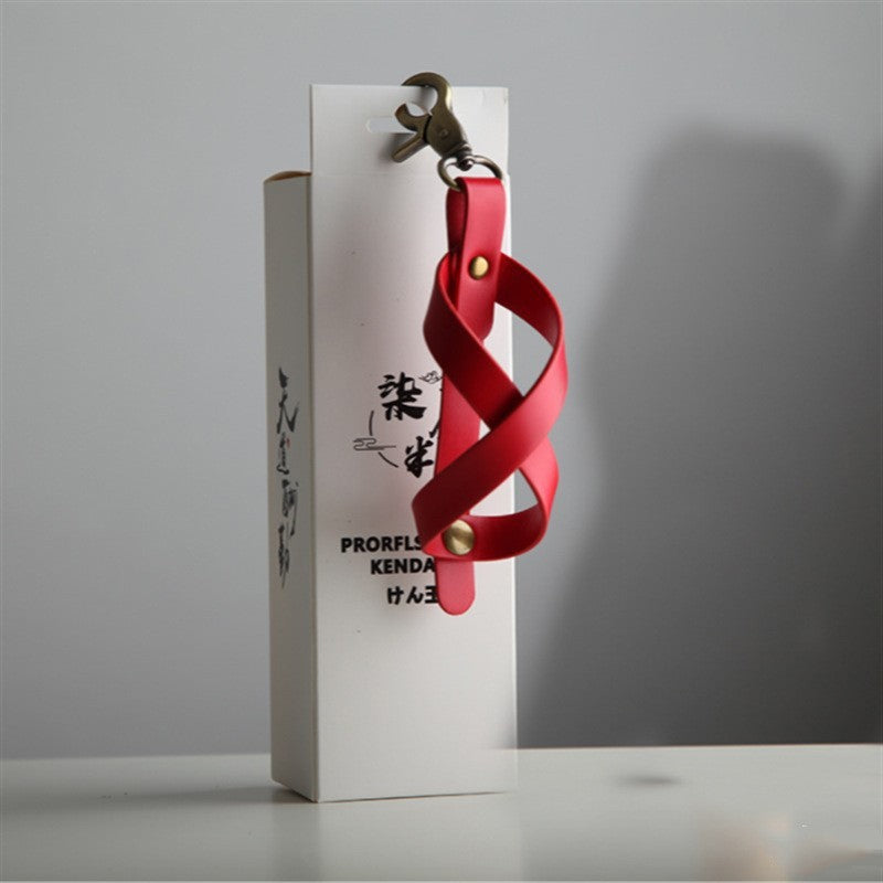 Husa pentru Kendama, Suport Depozitare si Transport cu Catarama de Agatare Tip Breloc, Piele Ecologica, 12 x 6 cm, Rosu